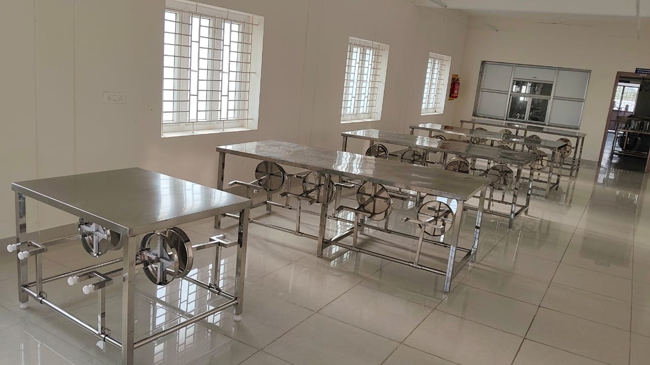 Comfortable student hostel room with study desk and bed