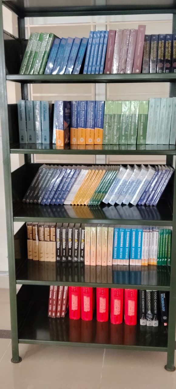 Spacious library reading room with bookshelves and study tables